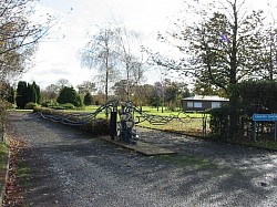 Cemetery entrance gates with “arms” in their closed position